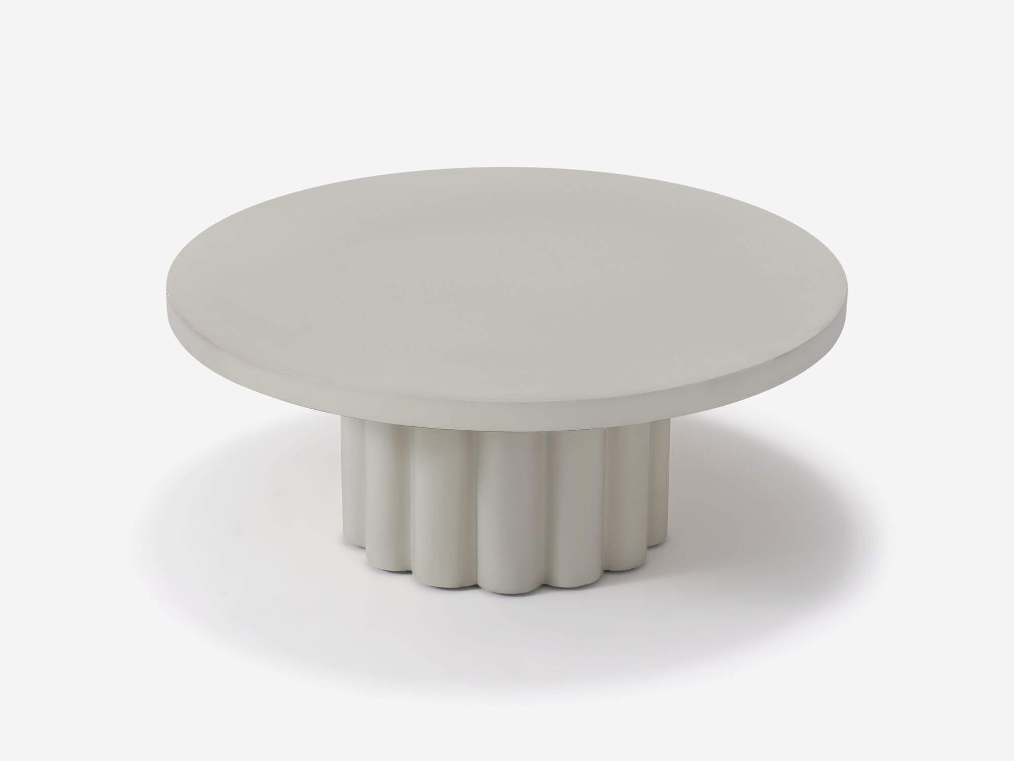 Detail view of round white coffee table